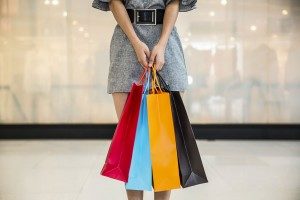 woman-with-shopping-bags-300x200