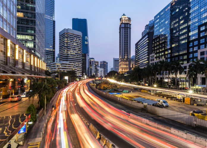 Jakarta rush hour in business district in Indonesia capital city at night
