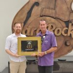 John Primmer (right), Hard Rock Hotel Penang General Manager recieves the Best Hotel Development Awards from Dot Property Magazine Editor in Chief Cheyenne Hollis (left)
