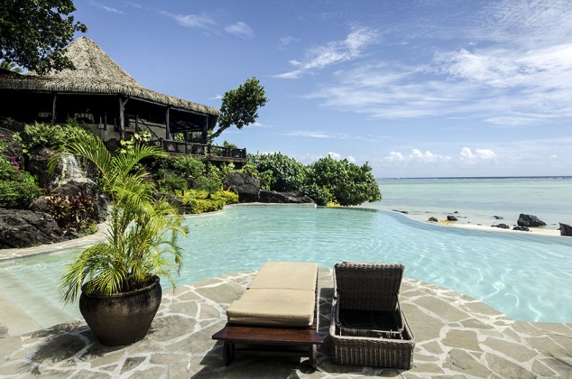 Beautiful beach front bungalow with a crystal clear pool and sunny weather and sun beds