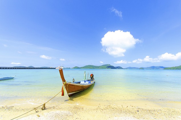 View of Phuket beach and ocean and a boat.Thailand-Property.com