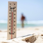 A thermometer shows hight temperature during a heatwave on the beach.Thailand-Property.com