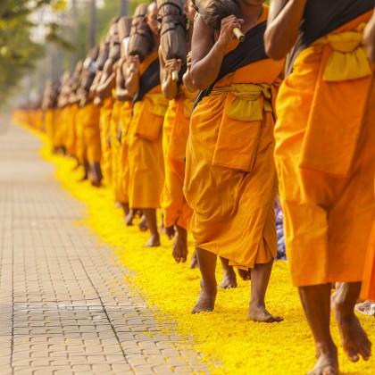 Row of Monks in Thailand. Thailand-Property.com