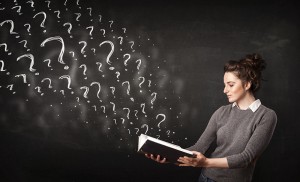 Confused woman reading a book with question marks coming out from it.Thailand-Property.com