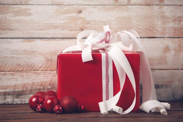 Christmas Present and Ornaments on Wooden Background.Thailand-Property.com