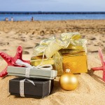 christmas gifts with stafish on beach with golden sand at sunny day. Thailand-Property.com