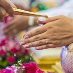 Photo of a Thai bride receiving holy water from her elders. Thailand-Property.com