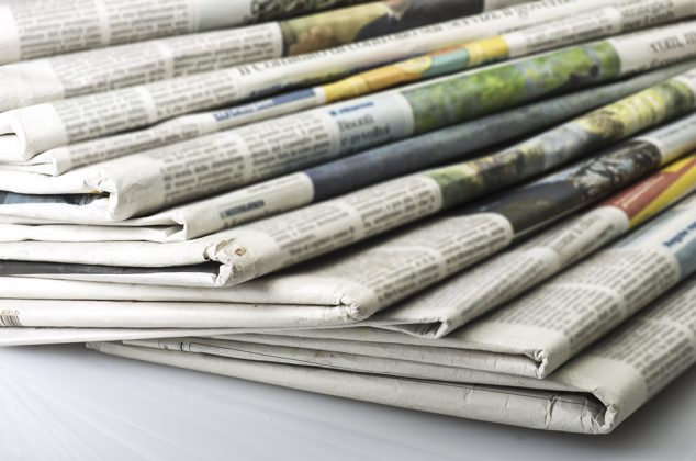 Pile of Various newspapers over white background. Thailand-Property.com