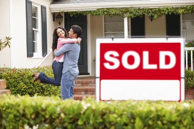 Happy couple who have just sold their property.