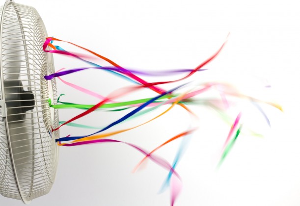 Bright colorful silk ribbons on an electric fan