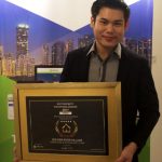 Furen Land Executive Michael Tan with the award